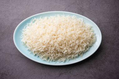 Aromatic Long Basmati cooked plain Rice is an Indian main course food, served in a bowl. selective focus