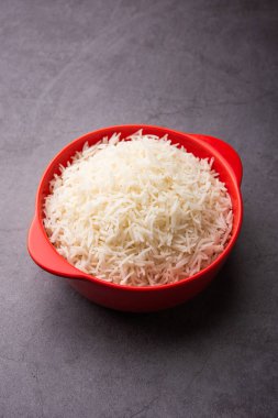 Aromatic Long Basmati cooked plain Rice is an Indian main course food, served in a bowl. selective focus