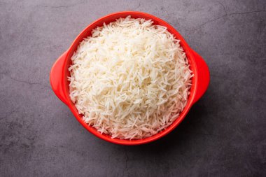Aromatic Long Basmati cooked plain Rice is an Indian main course food, served in a bowl. selective focus
