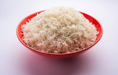 Aromatic Long Basmati cooked plain Rice is an Indian main course food, served in a bowl. selective focus