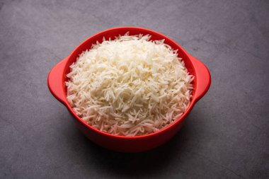 Aromatic Long Basmati cooked plain Rice is an Indian main course food, served in a bowl. selective focus