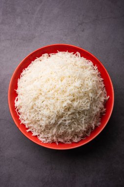 Aromatic Long Basmati cooked plain Rice is an Indian main course food, served in a bowl. selective focus