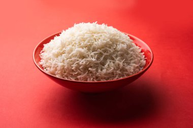 Aromatic Long Basmati cooked plain Rice is an Indian main course food, served in a bowl. selective focus