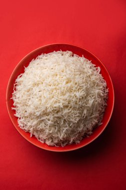 Aromatic Long Basmati cooked plain Rice is an Indian main course food, served in a bowl. selective focus