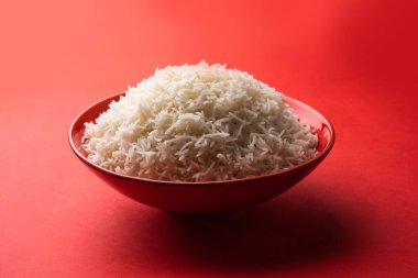 Aromatic Long Basmati cooked plain Rice is an Indian main course food, served in a bowl. selective focus