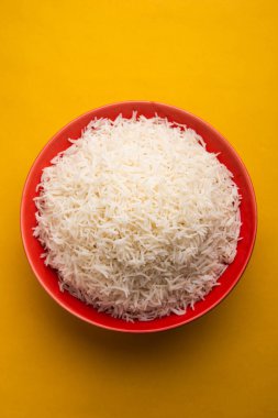 Aromatic Long Basmati cooked plain Rice is an Indian main course food, served in a bowl. selective focus