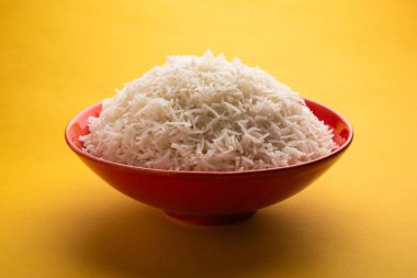 Aromatic Long Basmati cooked plain Rice is an Indian main course food, served in a bowl. selective focus