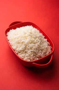 Aromatic Long Basmati cooked plain Rice is an Indian main course food, served in a bowl. selective focus