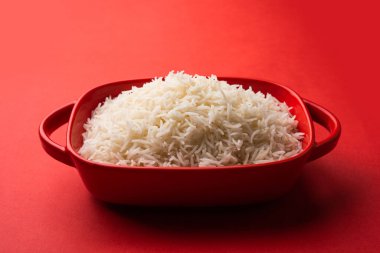 Aromatic Long Basmati cooked plain Rice is an Indian main course food, served in a bowl. selective focus