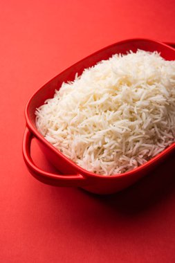 Aromatic Long Basmati cooked plain Rice is an Indian main course food, served in a bowl. selective focus