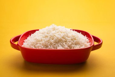 Aromatic Long Basmati cooked plain Rice is an Indian main course food, served in a bowl. selective focus