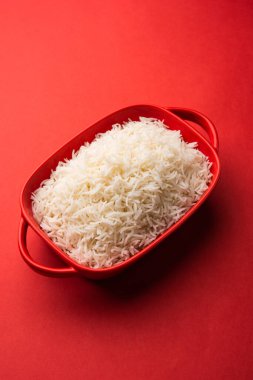 Aromatic Long Basmati cooked plain Rice is an Indian main course food, served in a bowl. selective focus
