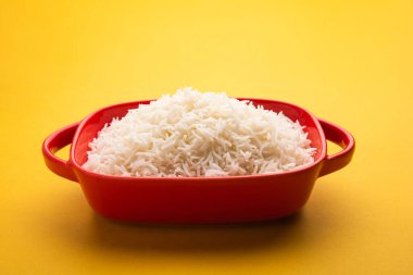 Aromatic Long Basmati cooked plain Rice is an Indian main course food, served in a bowl. selective focus