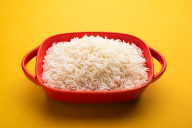 Aromatic Long Basmati cooked plain Rice is an Indian main course food, served in a bowl. selective focus