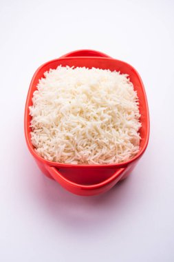 Aromatic Long Basmati cooked plain Rice is an Indian main course food, served in a bowl. selective focus
