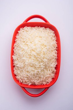 Aromatic Long Basmati cooked plain Rice is an Indian main course food, served in a bowl. selective focus