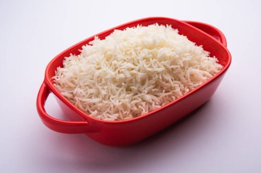 Aromatic Long Basmati cooked plain Rice is an Indian main course food, served in a bowl. selective focus
