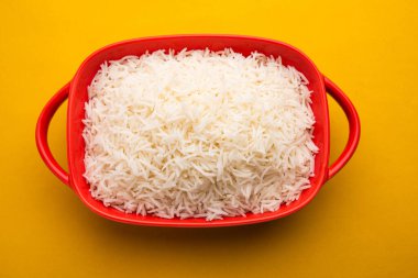 Aromatic Long Basmati cooked plain Rice is an Indian main course food, served in a bowl. selective focus