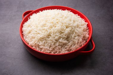 Aromatic Long Basmati cooked plain Rice is an Indian main course food, served in a bowl. selective focus