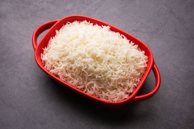 Aromatic Long Basmati cooked plain Rice is an Indian main course food, served in a bowl. selective focus