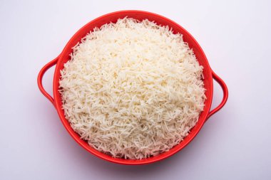 Aromatic Long Basmati cooked plain Rice is an Indian main course food, served in a bowl. selective focus