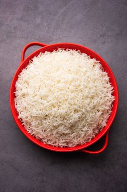 Aromatic Long Basmati cooked plain Rice is an Indian main course food, served in a bowl. selective focus