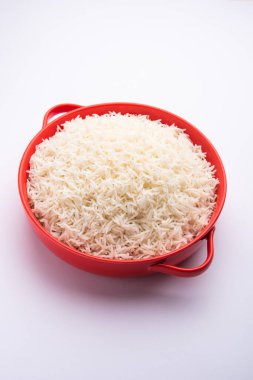 Aromatic Long Basmati cooked plain Rice is an Indian main course food, served in a bowl. selective focus