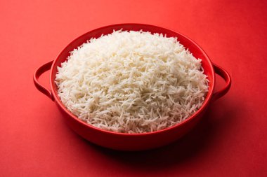 Aromatic Long Basmati cooked plain Rice is an Indian main course food, served in a bowl. selective focus