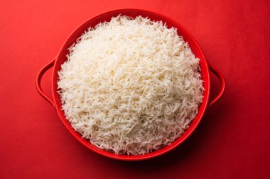 Aromatic Long Basmati cooked plain Rice is an Indian main course food, served in a bowl. selective focus