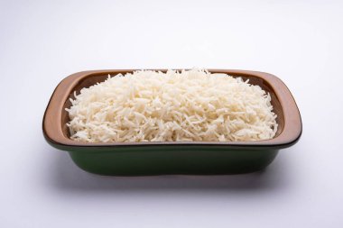 Aromatic Long Basmati cooked plain Rice is an Indian main course food, served in a bowl. selective focus