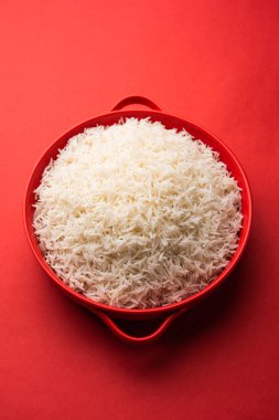 Aromatic Long Basmati cooked plain Rice is an Indian main course food, served in a bowl. selective focus