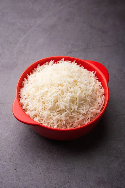 Aromatic Long Basmati cooked plain Rice is an Indian main course food, served in a bowl. selective focus