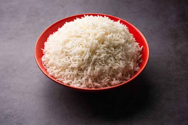 Aromatic Long Basmati cooked plain Rice is an Indian main course food, served in a bowl. selective focus