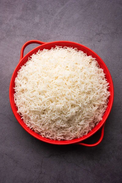 Aromatic Long Basmati cooked plain Rice is an Indian main course food, served in a bowl. selective focus