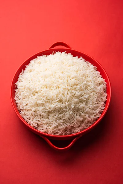 Aromatic Long Basmati cooked plain Rice is an Indian main course food, served in a bowl. selective focus