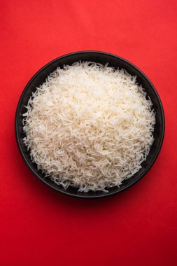Aromatic Long Basmati cooked plain Rice is an Indian main course food, served in a bowl. selective focus