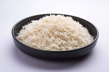 Aromatic Long Basmati cooked plain Rice is an Indian main course food, served in a bowl. selective focus