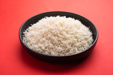 Aromatic Long Basmati cooked plain Rice is an Indian main course food, served in a bowl. selective focus
