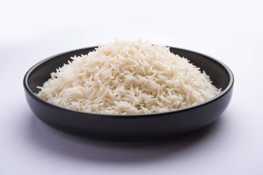Aromatic Long Basmati cooked plain Rice is an Indian main course food, served in a bowl. selective focus