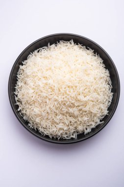 Aromatic Long Basmati cooked plain Rice is an Indian main course food, served in a bowl. selective focus