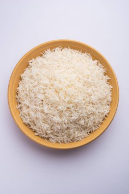 Aromatic Long Basmati cooked plain Rice is an Indian main course food, served in a bowl. selective focus