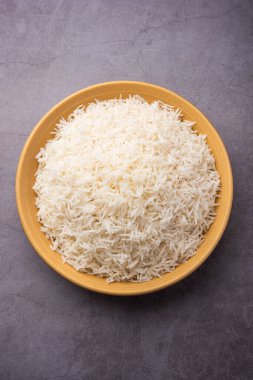 Aromatic Long Basmati cooked plain Rice is an Indian main course food, served in a bowl. selective focus