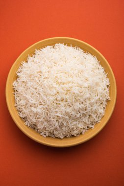 Aromatic Long Basmati cooked plain Rice is an Indian main course food, served in a bowl. selective focus