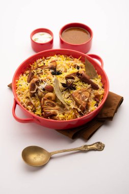 Kathal Biryani is made using raw jackfruit pieces cooked slowly with a variety of spices and mixed with basmati rice. served with curd and salan. Indian vegetarian food