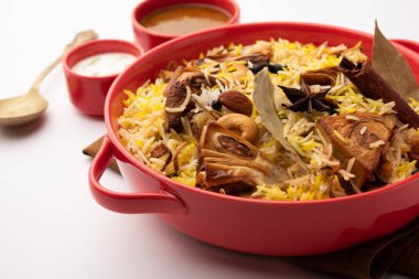 Kathal Biryani is made using raw jackfruit pieces cooked slowly with a variety of spices and mixed with basmati rice. served with curd and salan. Indian vegetarian food