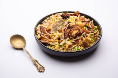 Kathal Biryani is made using raw jackfruit pieces cooked slowly with a variety of spices and mixed with basmati rice. served with curd and salan. Indian vegetarian food