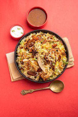 Kathal Biryani is made using raw jackfruit pieces cooked slowly with a variety of spices and mixed with basmati rice. served with curd and salan. Indian vegetarian food