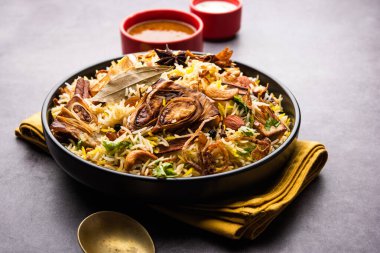 Kathal Biryani is made using raw jackfruit pieces cooked slowly with a variety of spices and mixed with basmati rice. served with curd and salan. Indian vegetarian food