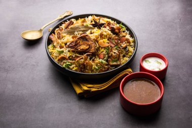 Kathal Biryani is made using raw jackfruit pieces cooked slowly with a variety of spices and mixed with basmati rice. served with curd and salan. Indian vegetarian food