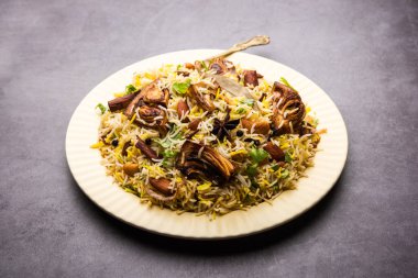 Kathal Biryani is made using raw jackfruit pieces cooked slowly with a variety of spices and mixed with basmati rice. served with curd and salan. Indian vegetarian food